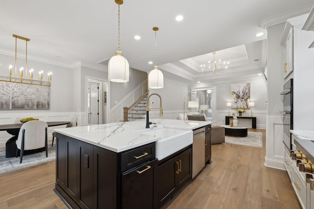 2143 White Poplar Ct, Murfreesboro, TN 37130 - kitchen featuring a chandelier, a sink, open floor plan, crown molding, and a decorative wall