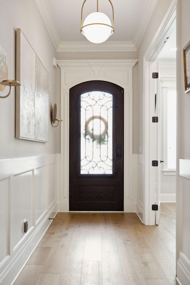 2143 White Poplar Ct, Murfreesboro, TN 37130 - foyer with light wood-style floors, plenty of natural light, crown molding, wainscoting, and a decorative wall
