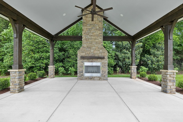 2143 White Poplar Ct, Murfreesboro, TN 37130 - view of patio / terrace featuring an outdoor stone fireplace, ceiling fan, and view of scattered trees