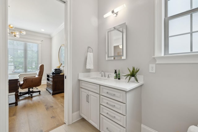 2143 White Poplar Ct, Murfreesboro, TN 37130 - bathroom featuring crown molding, vanity, baseboards, and wood finished floors