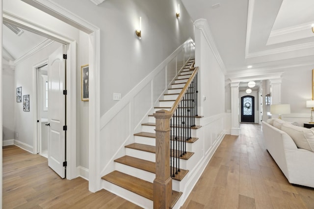 2143 White Poplar Ct, Murfreesboro, TN 37130 - staircase with decorative columns, wood-type flooring, crown molding, and a decorative wall