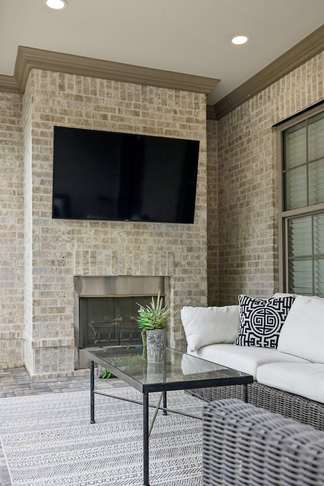 2143 White Poplar Ct, Murfreesboro, TN 37130 - living area featuring ornamental molding, a brick fireplace, and recessed lighting