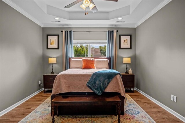 7211 Deervalley Dr, Fairview, TN 37062 - bedroom with a raised ceiling, baseboards, wood finished floors, ornamental molding, and recessed lighting