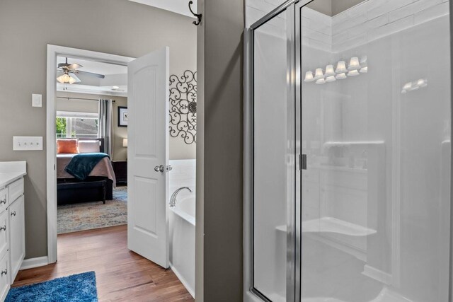 7211 Deervalley Dr, Fairview, TN 37062 - full bathroom featuring a shower stall, ensuite bath, ceiling fan, wood finished floors, and a garden tub