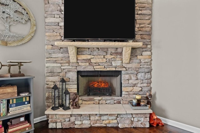7211 Deervalley Dr, Fairview, TN 37062 - detailed view of wood finished floors, baseboards, and a stone fireplace
