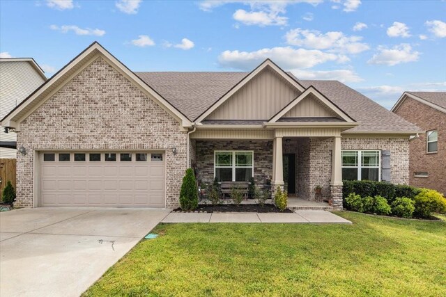 7211 Deervalley Dr, Fairview, TN 37062 - view of front of property featuring driveway, an attached garage, a front lawn, brick siding, and roof with shingles