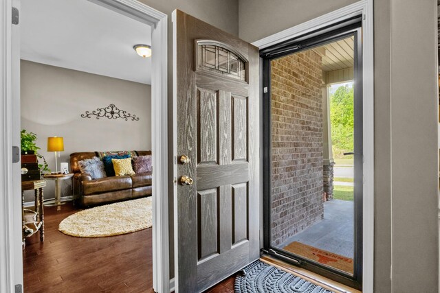 7211 Deervalley Dr, Fairview, TN 37062 - foyer featuring wood finished floors and brick wall