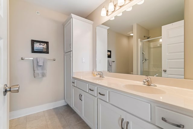 5008 Fennel Ct, Spring Hill, TN 37174 - full bathroom with an enclosed shower, baseboards, double vanity, and tile patterned flooring