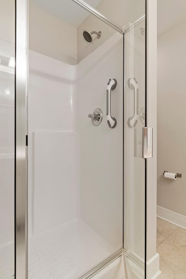 5008 Fennel Ct, Spring Hill, TN 37174 - full bathroom with a stall shower, tile patterned floors, and baseboards