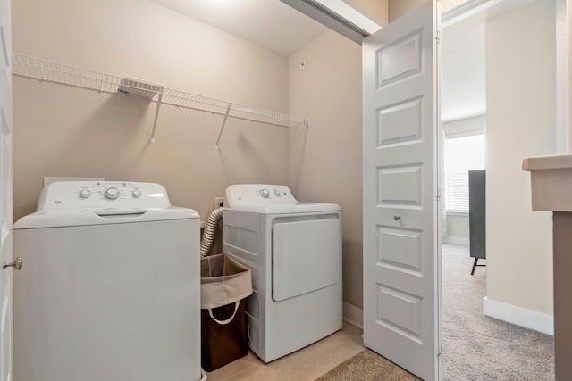 5008 Fennel Ct, Spring Hill, TN 37174 - laundry room with washer and dryer, baseboards, and light colored carpet