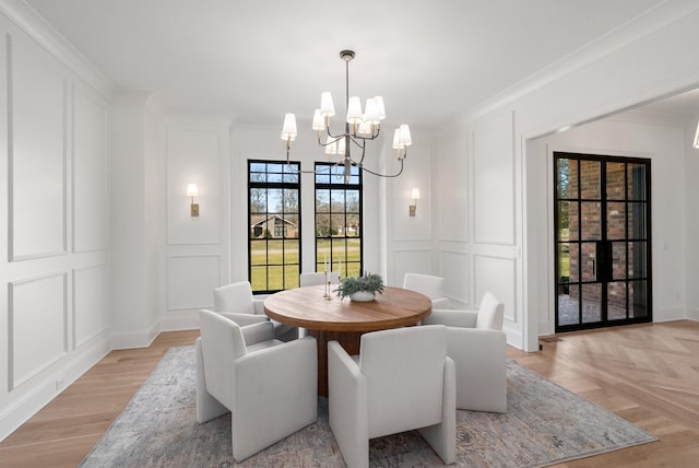 520 Mansion Dr, Brentwood, TN 37027 - dining room with a decorative wall, a chandelier, crown molding, and light wood-style flooring