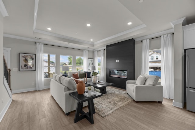 2507H Strong St, Columbia, TN 38401 - living room with a tray ceiling, a fireplace, light wood-style flooring, baseboards, and recessed lighting
