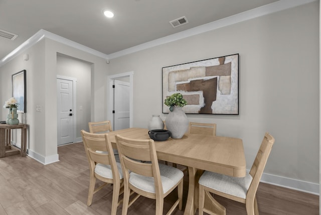 2507H Strong St, Columbia, TN 38401 - dining area featuring light wood finished floors, baseboards, and crown molding