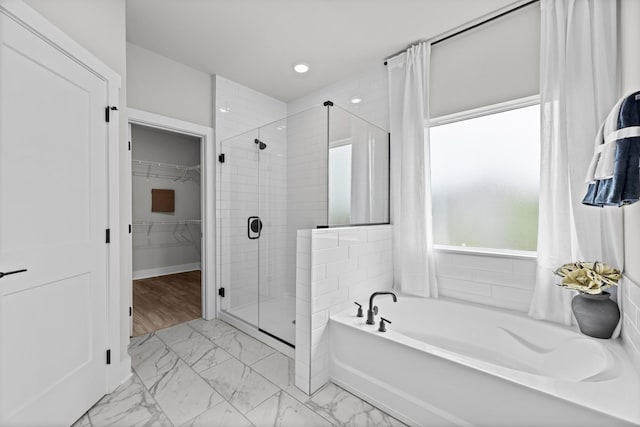 2507H Strong St, Columbia, TN 38401 - bathroom with marble finish flooring, a stall shower, a bath, a walk in closet, and recessed lighting