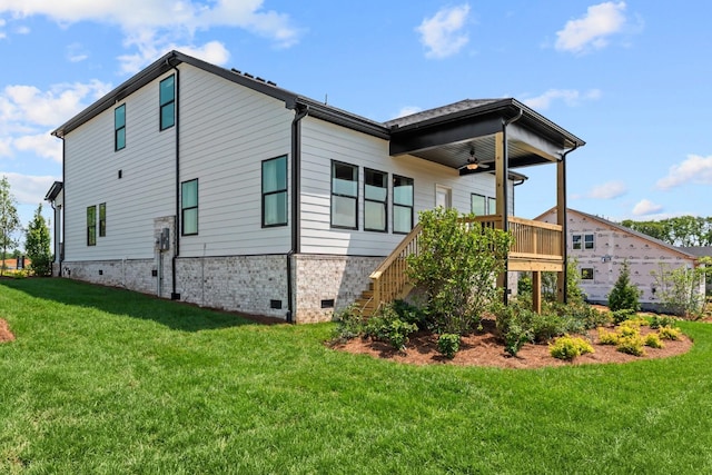 2507H Strong St, Columbia, TN 38401 - rear view of house featuring ceiling fan, crawl space, a lawn, and stairway