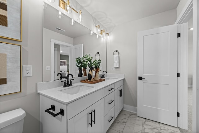 2507H Strong St, Columbia, TN 38401 - full bath featuring toilet, marble finish floors, double vanity, and baseboards