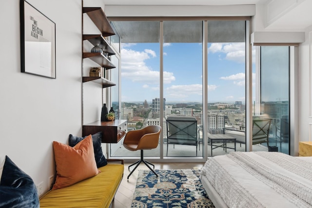 1616 W End Ave Unit 2008, Nashville, TN 37203 - bedroom featuring access to outside, a view of city, wood finished floors, and floor to ceiling windows