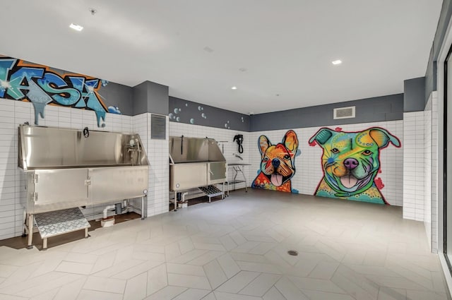 1616 W End Ave Unit 2008, Nashville, TN 37203 - game room featuring pet washing station and tile walls