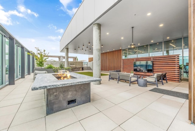 1616 W End Ave Unit 2008, Nashville, TN 37203 - view of patio / terrace featuring an outdoor living space with a fire pit