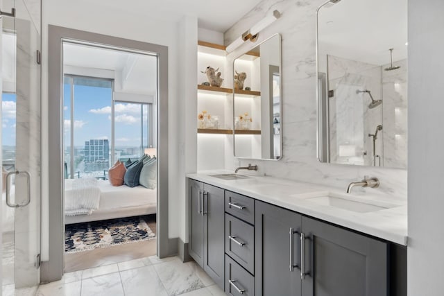 1616 W End Ave Unit 2008, Nashville, TN 37203 - ensuite bathroom featuring a shower stall, double vanity, marble look tiles, and a city view