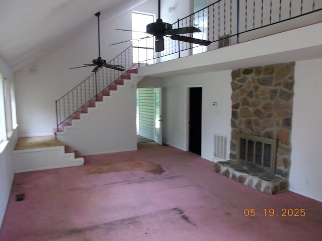 4064 Elizabeth Dr, Hermitage, TN 37076 - unfurnished living room with high vaulted ceiling, ceiling fan, stairway, and carpet flooring