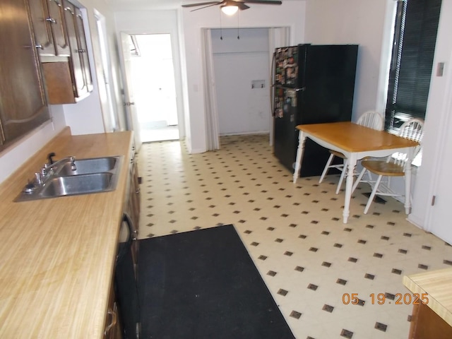 4064 Elizabeth Dr, Hermitage, TN 37076 - kitchen featuring freestanding refrigerator, light floors, a ceiling fan, and a sink