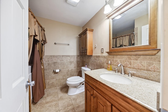 206 Crestland Dr, Columbia, TN 38401 - full bathroom with tile walls, vanity, toilet, and a wainscoted wall