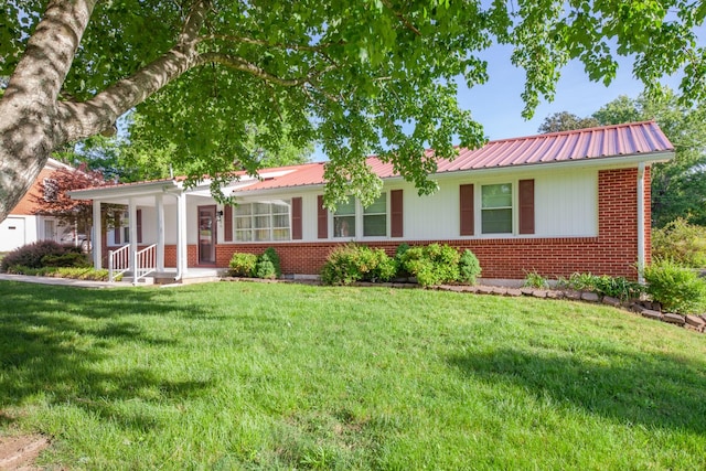 206 Crestland Dr, Columbia, TN 38401 - single story home with brick siding, a front lawn, a porch, and metal roof