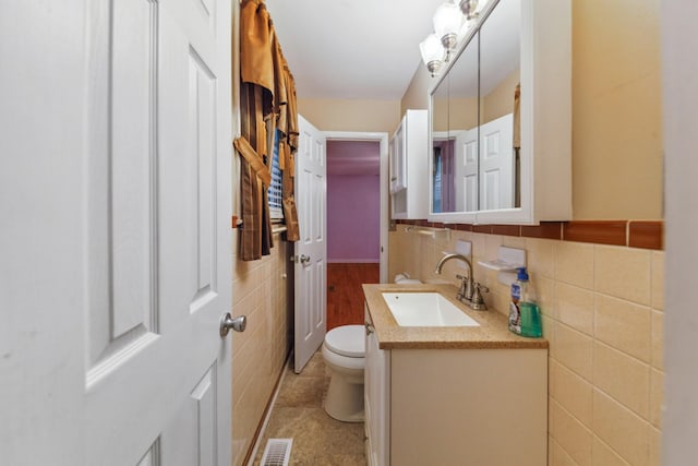206 Crestland Dr, Columbia, TN 38401 - bathroom with tile walls, toilet, vanity, and tile patterned flooring