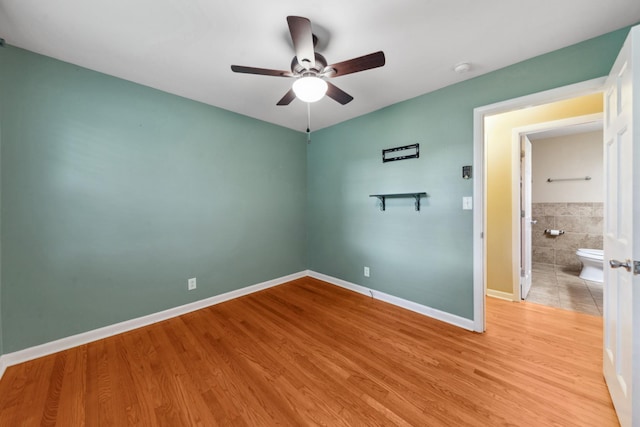 206 Crestland Dr, Columbia, TN 38401 - spare room with ceiling fan, light wood-style floors, baseboards, and tile walls