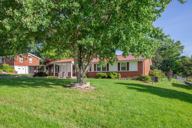 206 Crestland Dr, Columbia, TN 38401 - single story home featuring a garage, cooling unit, brick siding, and metal roof