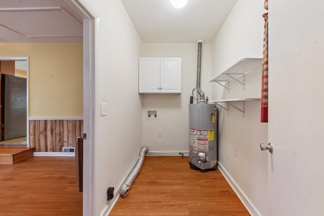 206 Crestland Dr, Columbia, TN 38401 - laundry room featuring gas water heater, hookup for a washing machine, cabinet space, and light wood-style floors