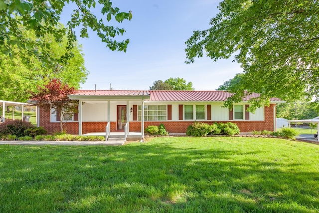 206 Crestland Dr, Columbia, TN 38401 - ranch-style home featuring a front yard, brick siding, metal roof, and covered porch
