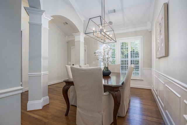 960 Caldwell Ln, Nashville, TN 37204 - dining space with dark wood finished floors, decorative columns, arched walkways, a chandelier, and a wainscoted wall