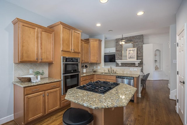 960 Caldwell Ln, Nashville, TN 37204 - kitchen featuring stainless steel appliances, a sink, a peninsula, backsplash, and dark wood-type flooring