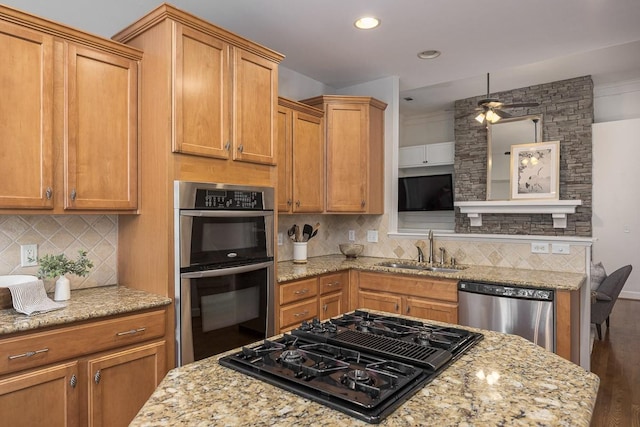 960 Caldwell Ln, Nashville, TN 37204 - kitchen with a sink, stainless steel appliances, dark wood-type flooring, light stone counters, and recessed lighting