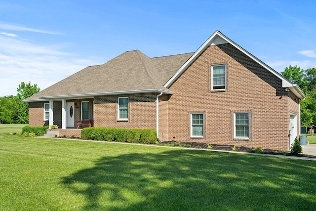 1020 Loganview Way, Springfield, TN 37172 - view of front of home with brick siding, a front yard, and a shingled roof