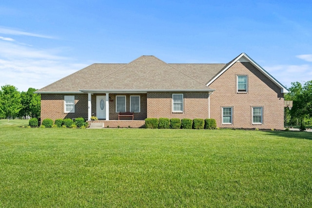 1020 Loganview Way, Springfield, TN 37172 - view of front of house featuring brick siding, a front lawn, roof with shingles, and a porch