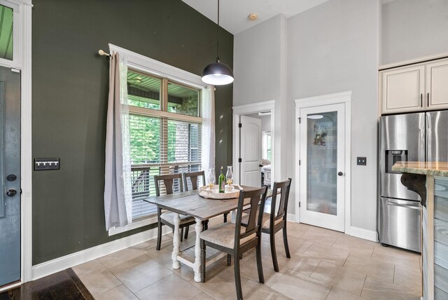 1161 Reda Dr, Clarksville, TN 37042 - dining room with a towering ceiling, baseboards, and light tile patterned floors