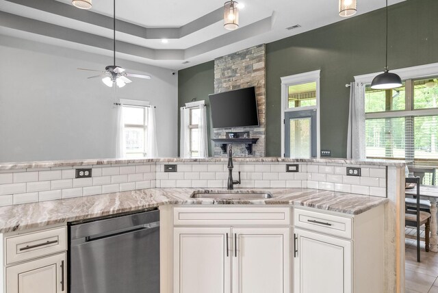 1161 Reda Dr, Clarksville, TN 37042 - kitchen with dishwasher, a sink, a raised ceiling, a ceiling fan, and healthy amount of natural light