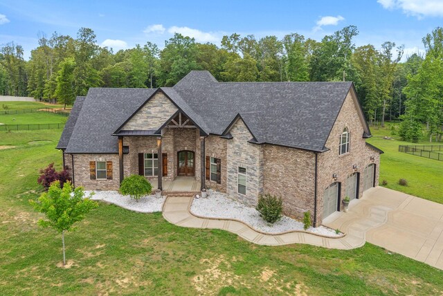 1161 Reda Dr, Clarksville, TN 37042 - view of front of property featuring a garage, stone siding, concrete driveway, and roof with shingles