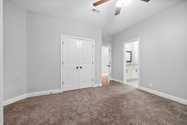 1161 Reda Dr, Clarksville, TN 37042 - unfurnished bedroom featuring carpet flooring, baseboards, a closet, a ceiling fan, and ensuite bath