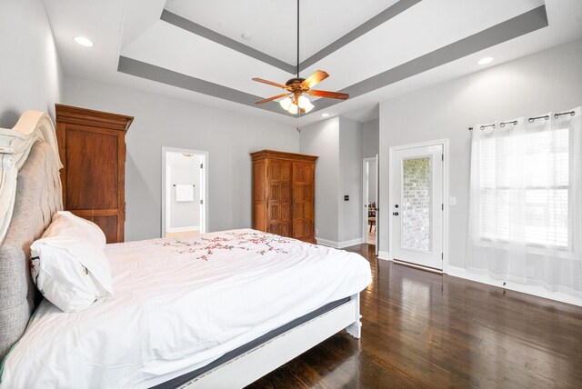1161 Reda Dr, Clarksville, TN 37042 - bedroom featuring dark wood-style floors, access to exterior, a raised ceiling, recessed lighting, and baseboards