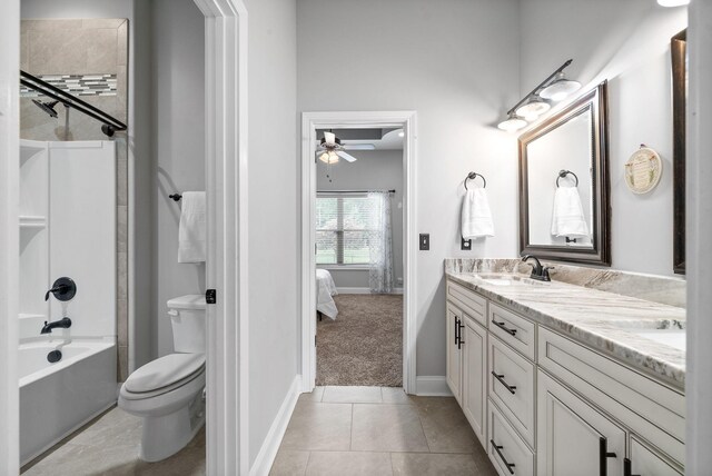 1161 Reda Dr, Clarksville, TN 37042 - full bath featuring ceiling fan, double vanity, toilet, baseboards, and tile patterned flooring