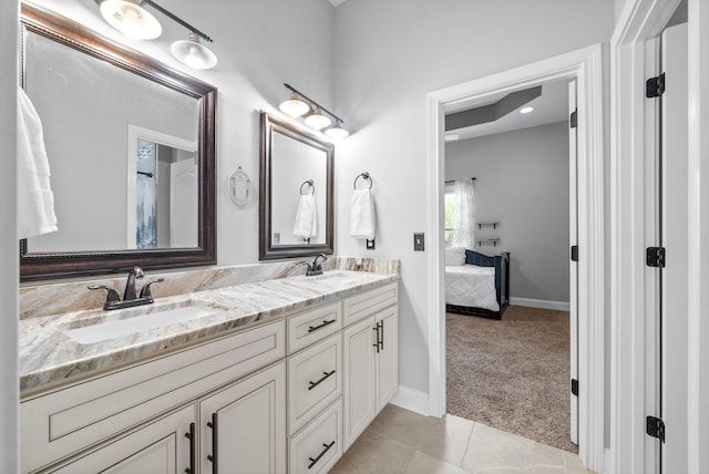1161 Reda Dr, Clarksville, TN 37042 - ensuite bathroom featuring double vanity, baseboards, and tile patterned floors