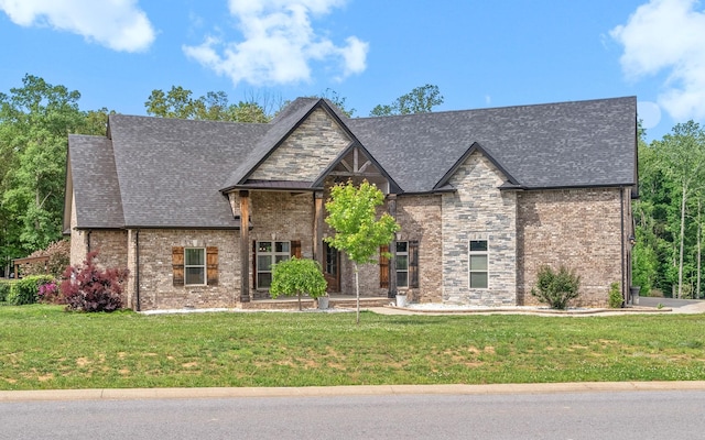 1161 Reda Dr, Clarksville, TN 37042 - view of front facade with a front lawn, brick siding, and roof with shingles