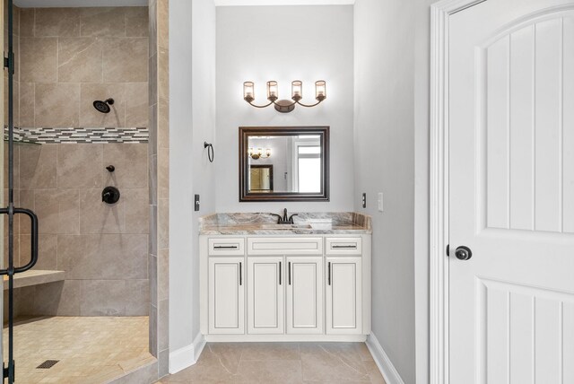 1161 Reda Dr, Clarksville, TN 37042 - bathroom featuring a stall shower, baseboards, and vanity