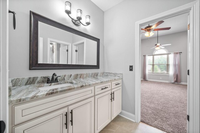 1161 Reda Dr, Clarksville, TN 37042 - bathroom featuring ceiling fan, baseboards, and vanity