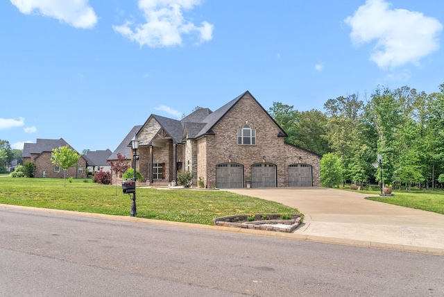 1161 Reda Dr, Clarksville, TN 37042 - french country inspired facade with brick siding, driveway, a front lawn, and a garage