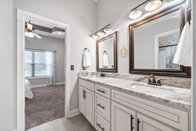 1161 Reda Dr, Clarksville, TN 37042 - bathroom with double vanity, baseboards, ceiling fan, and tile patterned floors